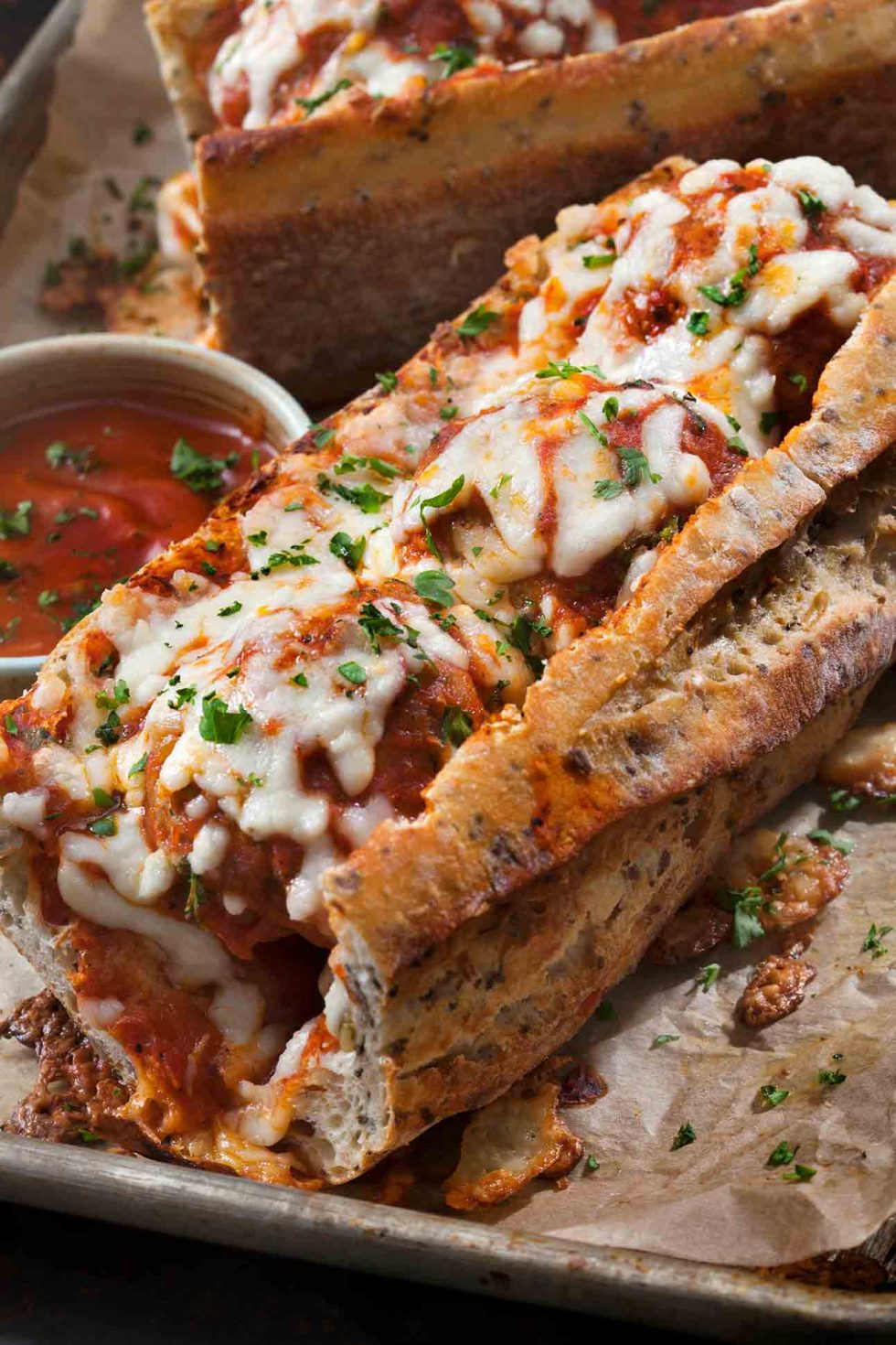 Calgary Food Photography. Cheesy meatball marinara sub on fresh handcrafted baguette.