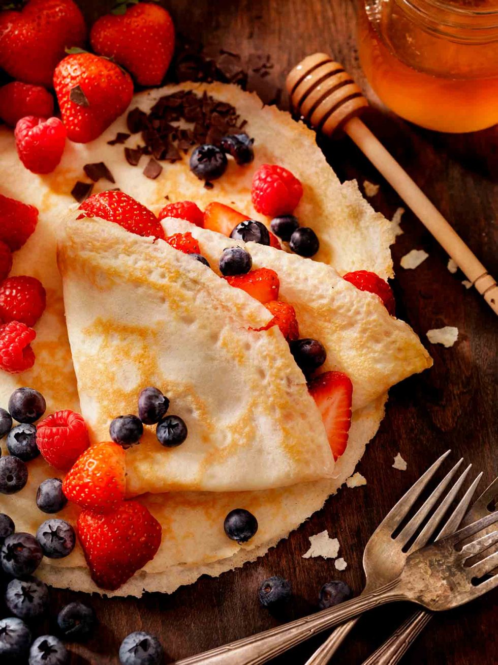 Calgary Food Photography. Crepes and berries on rustic backdrop.