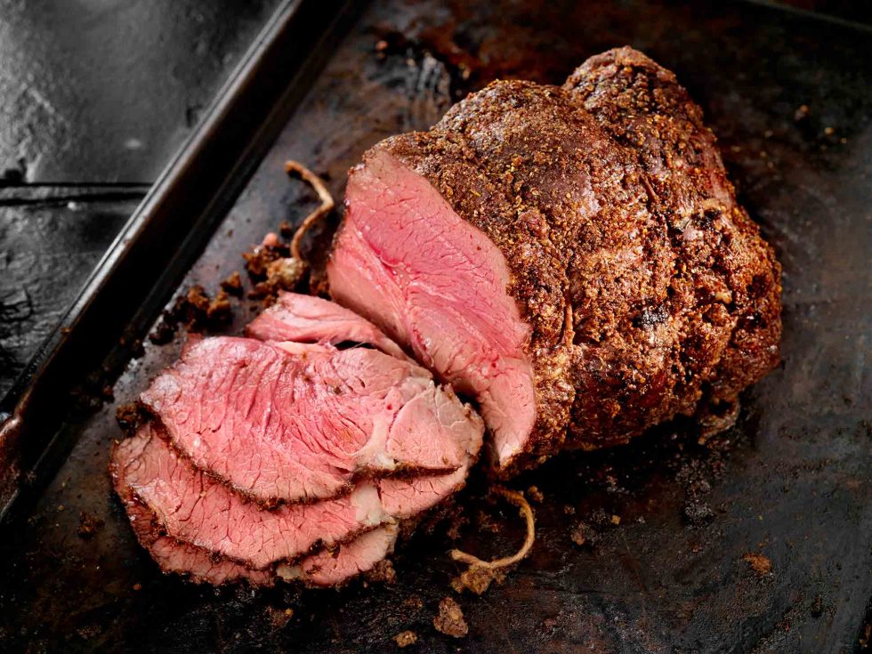 Calgary Food Photography. Perfectly cooked and sliced roast on slate backdrop.